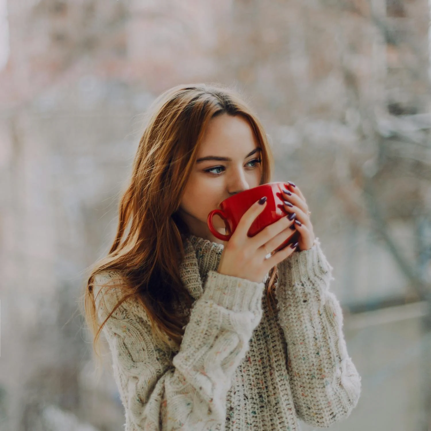 Young Woman Drinking Coffee
